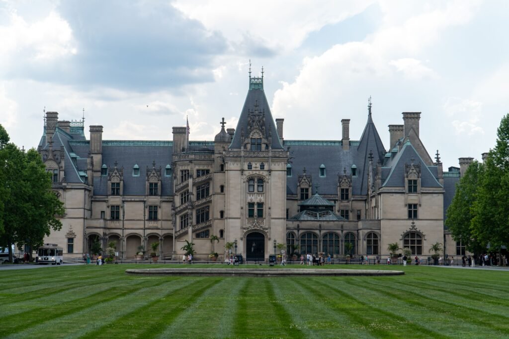 Grand facade of the Biltmore Estate with manicured lawns in Asheville, North Carolina