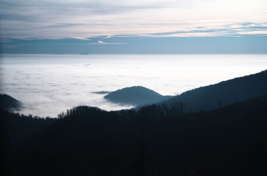 Blue Ridge mountain ridges rising above a sea of clouds at dawn in the high country near Boone, North Carolina