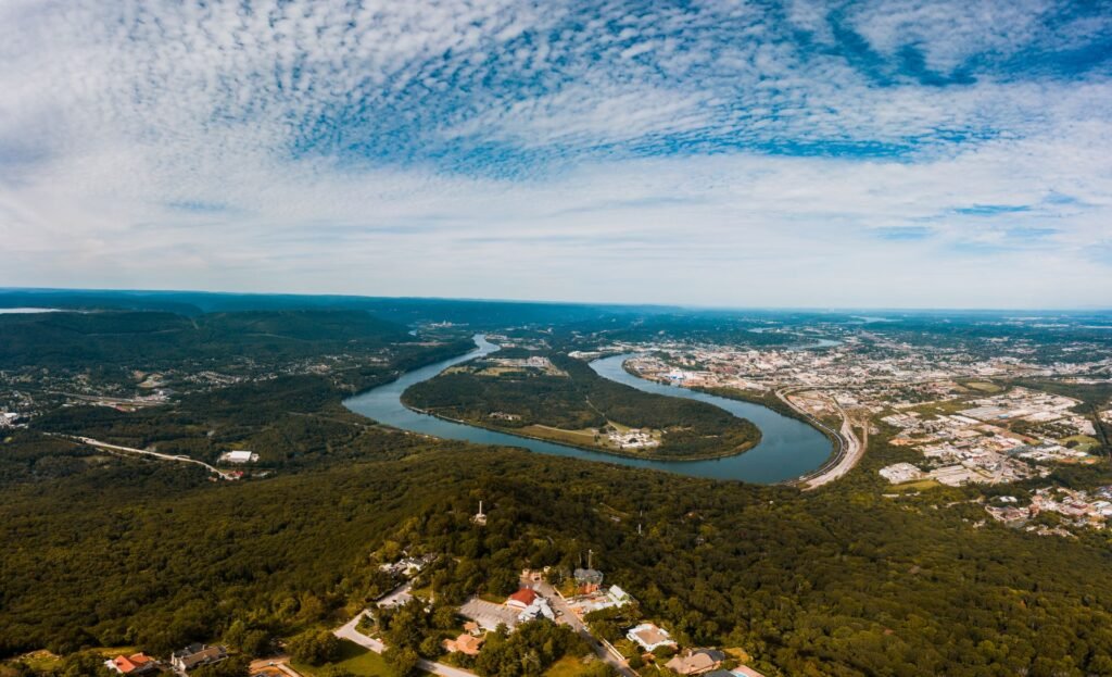 Aerial view of the Tennessee River winding past forests near Moccasin Bend in Chattanooga