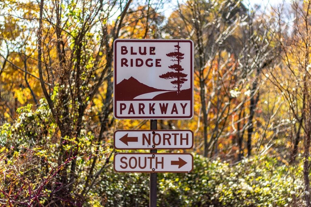 Blue Ridge Parkway directional sign with autumn leaves in Cherokee, North Carolina