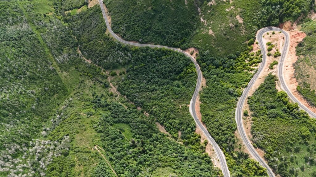 Highway winding toward the Blue Ridge Mountains on the drive from Charlotte to Asheville