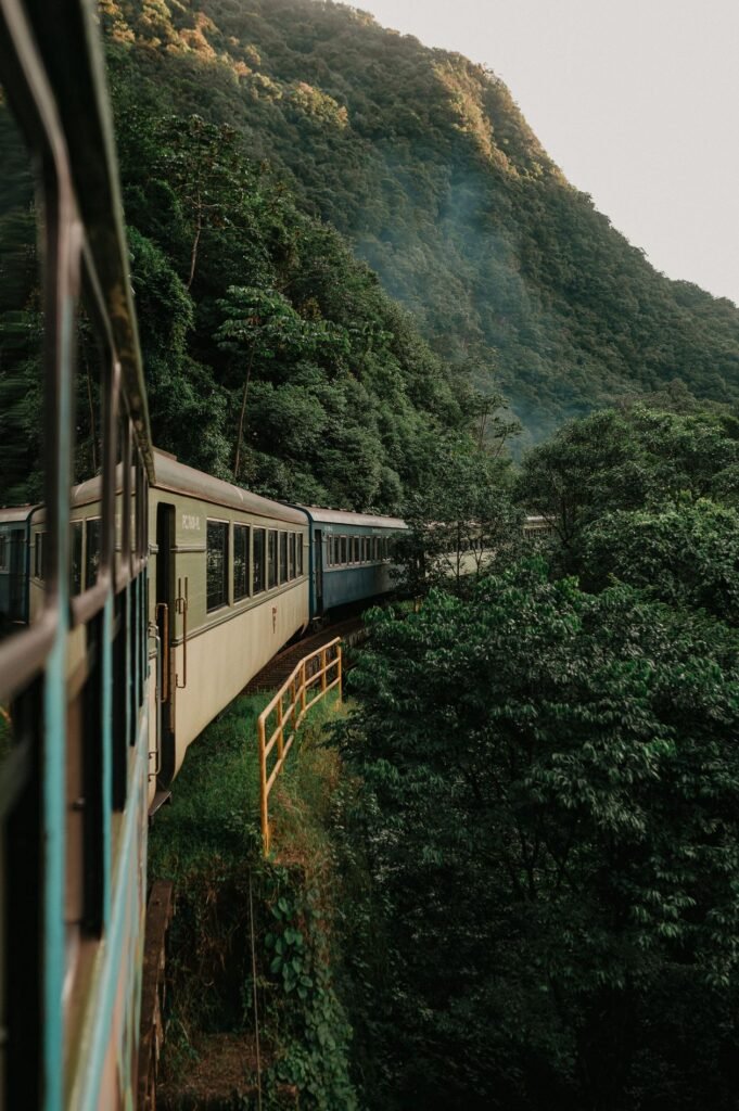 Scenic excursion train traveling through forested mountains in western North Carolina